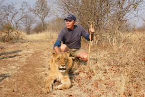 David with Lion on Africa Gay Men Tours